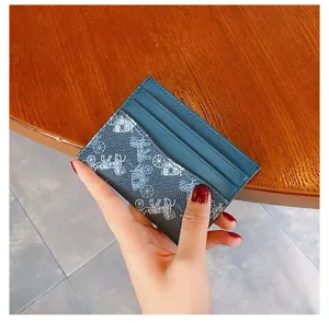 Detailed view of the stylish women card holder with vintage carriage print slim compact design.
