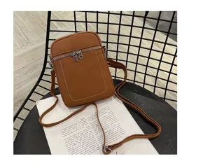 Brown leather mini crossbody phone bag with front zipper pocket and slim shoulder strap.