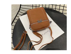 Brown leather mini cell phone bag for women, stylish small crossbody shoulder bag detail view.