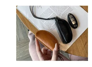 Genuine leather mini coin purse key pouch, perfect for everyday use and style.