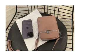 Pink leather mini crossbody phone bag detail view, casual small shoulder bag for women.