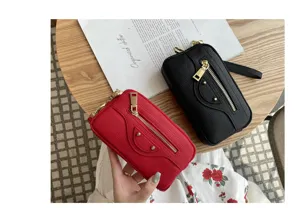 Genuine leather motorcycle clutch bag with double zipper design and stylish studs detail.