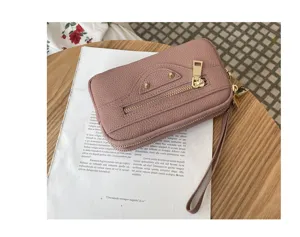 Pink genuine leather women clutch bag, motorcycle style with double zipper and metal studs.
