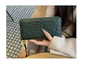 Dark green long genuine leather wallet with elegant embossed camellia flower design, zip around.