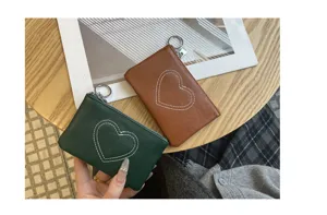 Compact leather coin purse and card holder with cute heart stitching for daily use.