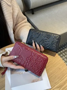 Women genuine leather long zipper wallet with elegant embossed camellia flower design purse.