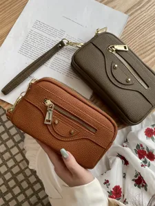 Genuine leather women clutch bag, stylish motorcycle design with double zipper and metal studs.