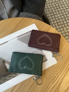 Women's vintage leather coin purse with heart stitching, mini card holder and zipper pouch.