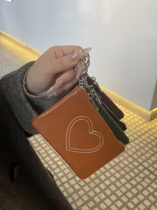 Genuine leather mini coin purse card holder for women, vintage style with cute heart stitch.