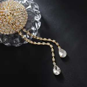 Detailed view of sparkly rhinestone tassel body jewelry set with teardrop gemstone charms.