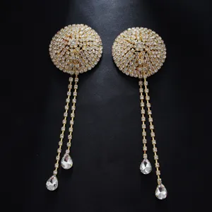 Rhinestone tassel pasties detail close up, sparkling crystal body jewelry accessories.