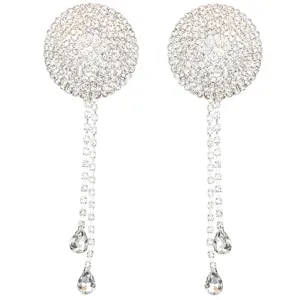 Close-up detail of sparkling rhinestone tassel nipple pasties, elegant crystal body jewelry.