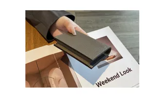 Detailed view of a premium genuine leather card holder with refined texture and neat stitching.