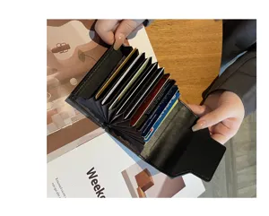 Black genuine leather multi-slot accordion card holder, compact and portable daily wallet.