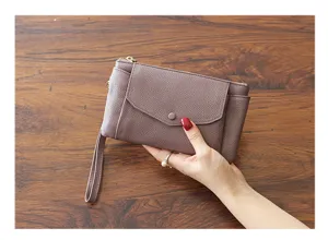 Minimalist women leather clutch wristlet bag detail view, casual phone wallet purse