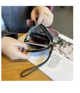 Detail view of mini genuine leather coin purse interior capacity and cute cat ear design.