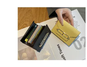 Luxury genuine leather card holder with multi slots and elegant metal chain closure.