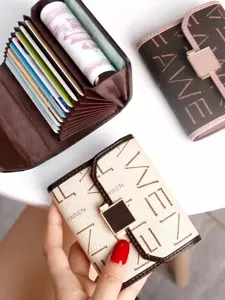 Compact accordion card holder for women with multiple slots and stylish monogram print.