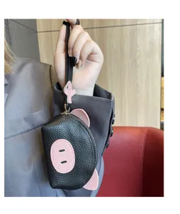 Cute pig leather coin purse mini wristlet wallet detail view for women daily fashion use.