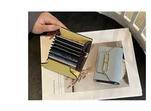 Multislot leather card holder with accordion design, elegant compact wallet for women daily use.