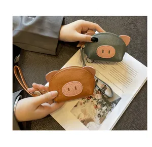 Cute genuine leather pig coin purse mini wallet with wrist strap and zipper for women.