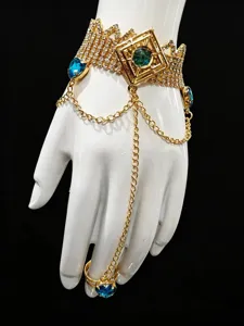 Detailed view of the sparkling gold rhinestone hand chain with colorful crystal gemstones.