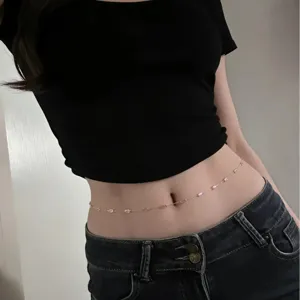 Rose gold waist chain with pink geometric rhinestones, versatile minimalist body jewelry.