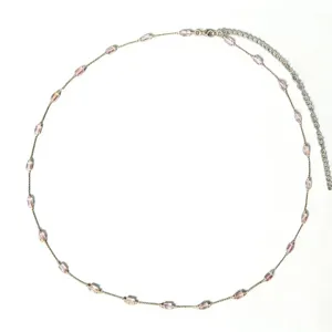 Minimalist rose gold waist chain for women, featuring delicate pink crystal geometric beads.