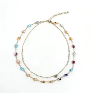 Double layer gold chain necklace with colorful beads and sweet heart pendant for women.