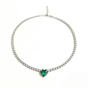 Elegant silver tennis necklace featuring a stunning green heart crystal pendant for women.