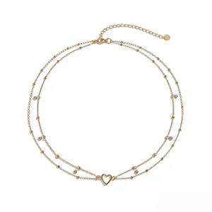 Elegant double layer gold waist chain body chain with heart pendant and sparkling rhinestones.