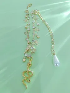 Gold layered anklet set with snake and pearl pendants, rhinestone bow beach foot jewelry.