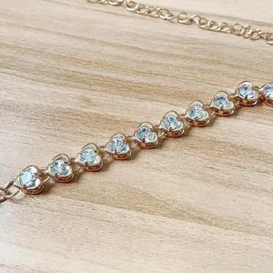 Elegant gold heart rhinestone body chain and sexy bikini chest chain jewelry for women.