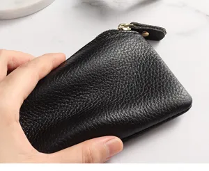 Genuine leather mini coin purse for women, small zipper change pouch and key holder detail.