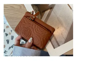Brown genuine leather coin purse for women, top layer cowhide floral embossed small wallet card holder.