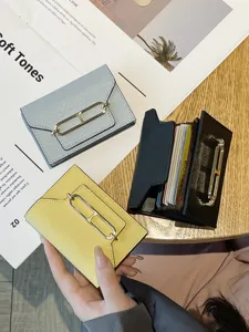 Stylish genuine leather card wallet for women with multiple slots and metallic clasp.