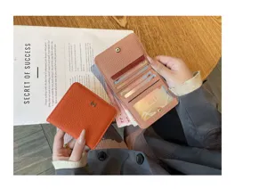 Genuine leather short wallet for women, compact card holder with multiple card slots.