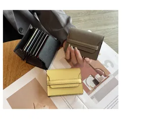Genuine leather compact card wallet with multi slots and anti-magnetic design for women.