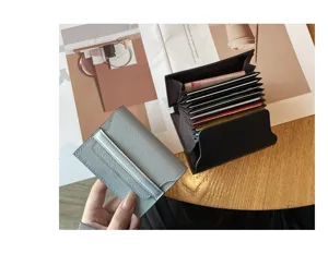 Detailed view of genuine leather multi-card accordion wallet and compact blue card holder.