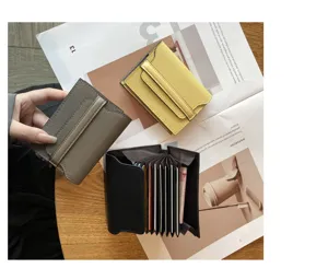 Detailed view of compact leather card holder featuring multi-slot accordion design and colors.