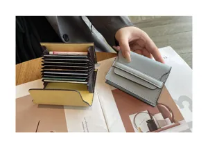 Detail view of genuine leather card holder with multiple accordion slots and compact minimalist design.