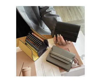 Detail view of mini leather card wallet with multi slots and accordion design for women.
