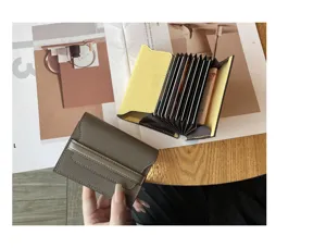 Genuine leather card holder with multiple slots and compact minimalist design for women.