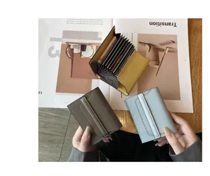 Genuine leather anti-magnetic card holder with multi slots, compact mini wallet detail view.