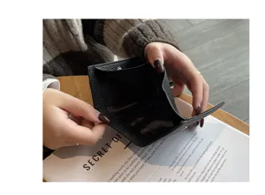 Black genuine leather wallet interior detail showing card slots and pocket design.