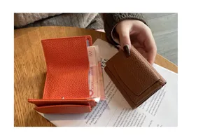 Genuine leather mini trifold short wallet for women with card slots and coin pocket detail.