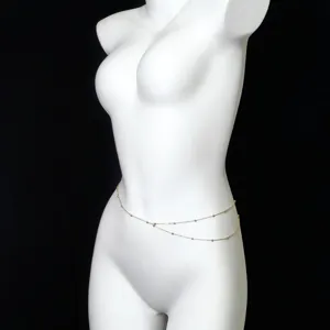 Elegant double-layer waist chain with delicate bead accents, stylish body jewelry for women.