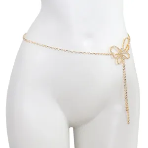 Close-up of sparkling rhinestone butterfly waist chain, elegant gold metal body jewelry detail.