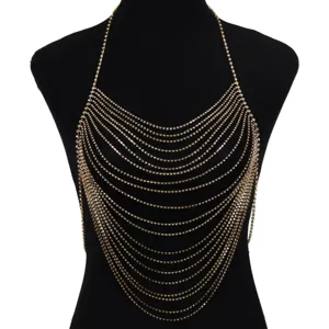 Detailed shot of a stunning multi-layer rhinestone body chain, glittering gold chest chain jewelry.