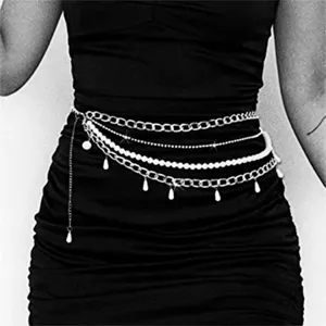 Multi-layer pearl waist chain detail, delicate metal links and drops for dresses and skirts.